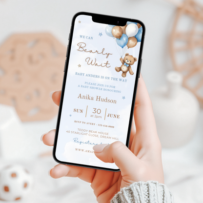 Baby shower invitation displayed on a smartphone screen with teddy bear theme in blue and white tones.